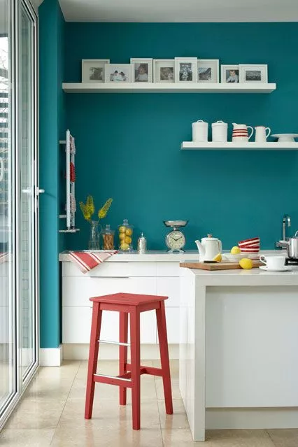 kitchen with bright teal walls at Easy Living